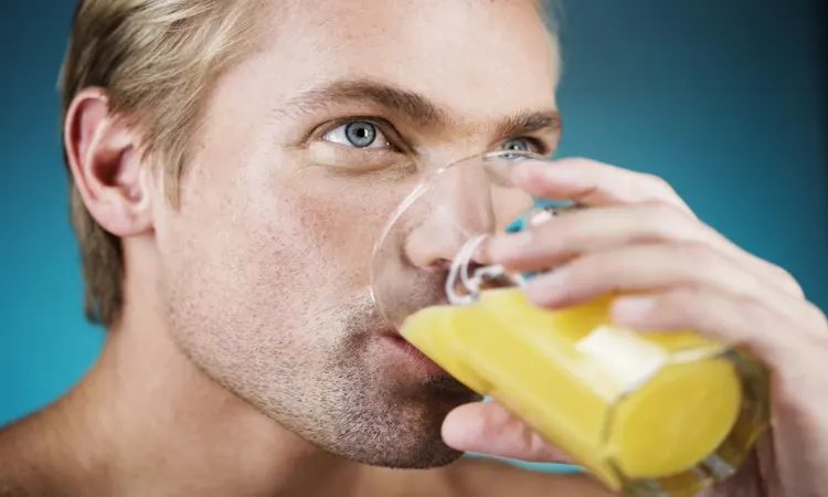 Male Hormone Detox Drink: Flush Estrogen Naturally Male hormone detox drink: flush estrogen naturally. A man drinking juice to support male hormonal health and energy.